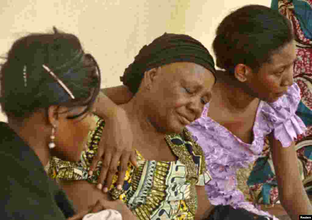 Relatives of victims of a gun attack mourn at the Aminu Kano Teaching Hospital in Nigeria's northern city of Kano April 29, 2012. Gunmen killed at least 15 people and wounded many more on Sunday in an attack on a university theatre being used by Christian