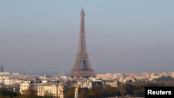 FILE - General view of the Eiffel tower behind the Seine river in Paris, France, April 14, 2019. 