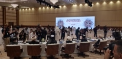 Media representatives were only allowed to briefly take pictures at the start of the intra-Afghan dialogue and was asked to leave before the opening statements, in Doha, Qatar, July 7, 2019. (A. Tanzeem/VOA)