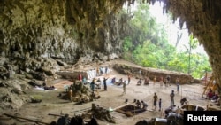 Archaeological excavations of Holocene deposits at Liang Bua on the Indonesian island of Flores are seen in progress in this undated handout picture courtesy of the Liang Bua Team. 