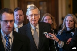 Senate Majority Leader Mitch McConnell, R-Ky., leaves the chamber after speaking about his plan to move a 1,300-page spending measure, which includes $5.7 billion to fund President Donald Trump's proposed wall along the U.S.-Mexico border, Jan. 22, 2019.