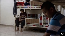 Juveniles linked to the Islamic State group rest in a rehabilitation center outside Qamishli, Syria, May 11, 2023.