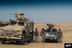 US-backed forces are pictured near the village of Susah in the eastern province of Deir el-Zour, near the Syrian border with Iraq on Sept. 13, 2018.