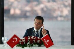 FILE - Ekrem Imamoglu, the new Mayor of Istanbul from Turkey's main opposition Republican People's Party (CHP), talks to members of foreign media in Istanbul, June 28, 2019.