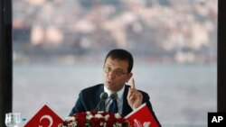 FILE - Ekrem Imamoglu, the new Mayor of Istanbul from Turkey's main opposition Republican People's Party (CHP), talks to members of foreign media in Istanbul, June 28, 2019. 