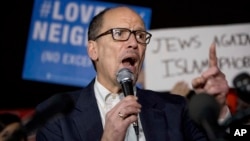 FILE - In this March 6, 2017 file photo, Democratic National Committee (DNC) Chairman Tom Perez speaks at a protest against President Donald Trump's new travel ban order in Lafayette Square outside the White House in Washington.