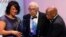 FILE - Journalist Simeon Booker, center, is presented with a Phoenix Award at the Congressional Black Caucus Foundation's annual Legislative Conference Phoenix Awards Dinner in Washington, Saturday, Sept. 18, 2010. 