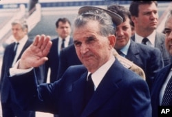 FILE - Romania's then-leader Nicolae Ceausescu is seen as he receives his Russian counterpart at Bucharest airport, in Bucharest, Romania, May 1987.