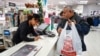 A shopper makes a purchase at the J.C. Penney department store in North Riverside, Illinois, Nov. 17, 2017. 