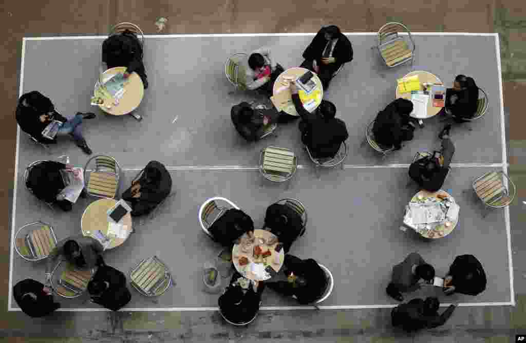 Visitors sit at tables at the Korea War Memorial Museum in Seoul, South Korea.