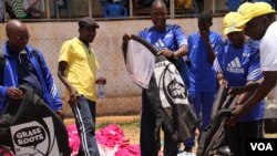 Coaches for the Malawi's Girls Grassroots Football program are seen getting ready to train a group of girls, in Zomba, Malawi. (L. Masina/VOA)