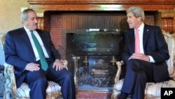 U.S. Secretary of State John Kerry, right, speaks to Jordanian Foreign Minister Nasser Judeh during a meeting at the U.S. ambassador's residence in Rome, May 9, 2013.