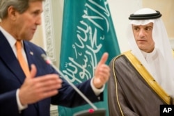 U.S. Secretary of State John Kerry, left, and Saudi Foreign Minister Adel al-Jubeir, right, hold a joint news conference at Riyadh Air Base in Saudi Arabia, Thursday, May 7, 2015.
