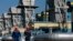 FILE - Workers are seen walking at a gas pipeline station in Uzhhorod, western Ukraine, May 21, 2014.