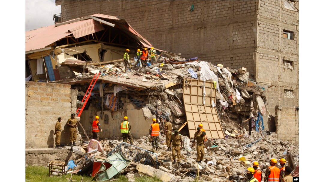 Rescuers work at the site of a building collapse in Nairobi, Kenya, June 13, 2017.