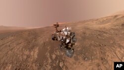This composite image made from a series of Jan. 23, 2018 photos shows a self-portrait of NASA's Curiosity Mars rover on Vera Rubin Ridge. The rover's arm which held the camera was positioned out of each of the dozens of shots which make up the mosaic.