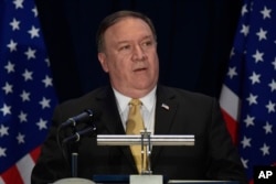 .S. Secretary of State Mike Pompeo speaks during a press briefing Monday, June 11, 2018 in Singapore one day before President Donald Trump will meet with North Korean leader Kim Jong Un.