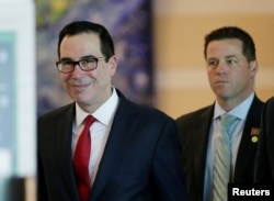 FILE - U.S. Treasury Secretary Steven Mnuchin is seen as he and a U.S. delegation member for trade talks with China, leave a hotel in Beijing, China, May 3, 2018.