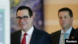 U.S. Treasury Secretary Steven Mnuchin is seen as he and a U.S. delegation member for trade talks with China, leave a hotel in Beijing, China, May 3, 2018.