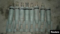 Cluster bombs, which activists say were dropped by a Syrian Air Force fighter jet, are displayed at Sowran near Aleppo in this October 30, 2012, file photo.