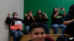 Students cheer as they watch wrestling matches at Somerton Middle School Aug. 19, 2021, in Somerton, Arizona. Contrary to Census data, the overwhelmingly Hispanic community has grown enough over the last decade that it's building a new elementary school.