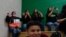 Students cheer as they watch wrestling matches at Somerton Middle School Aug. 19, 2021, in Somerton, Arizona. Contrary to Census data, the overwhelmingly Hispanic community has grown enough over the last decade that it's building a new elementary school.
