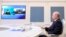 FILE - Russian President Vladimir Putin signs an agreement on railway construction with Iranian President Ebrahim Raisi via videoconference from Moscow on May 17, 2023. Russian officials said on Aug. 26, 2023, that its military ties to Iran will survive pressure from the U.S.