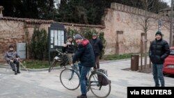 A group of residents gather in San Fiorano, one of the towns on lockdown because of a coronavirus outbreak, in this picture taken by schoolteacher Marzio Toniolo in San Fiorano, Italy, Feb. 25, 2020. 