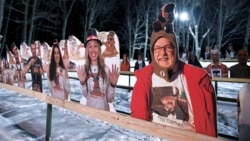 Cardboard cutouts of groundhog enthusiasts decorate Gobbler's Knob for the 135th celebration of Groundhog Day in Punxsutawney, Pa. Tuesday, Feb. 2, 2021. This year's event was held without anyone in attendance due to potential COVID-19 risks. (AP Photo/Ba