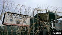 FILE - The front gate of Camp Delta is shown at the Guantanamo Bay Naval Station in Guantanamo Bay, Cuba.