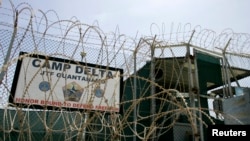 FILE - The front gate of Camp Delta is shown at the Guantanamo Bay Naval Station in Guantanamo Bay, Cuba.