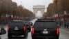 The motorcade of President Donald Trump drives up the Champs Elysees to an Armistice Day Centennial Commemoration at the Arc de Triomphe, Nov. 11, 2018, in Paris.