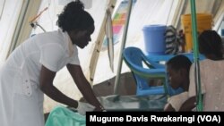 A nurse at a Doctors Without Borders cholera treatment center in Gudele, near Juba, inserts an intravenous drip to a woman infected by the diarrheal disease. The number of cases of cholera has risen steadily since the Health Ministry declared an outbreak