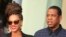 US pop star Beyonce (L) and her husband, rapper Jay-Z, are seen in front of their hotel in Havana April 4, 2013.