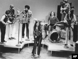 FILE - In this December 1969 file photo, singer Janis Joplin performs with her group Big Brother and the Holding Company. On drums is Dave Getz.
