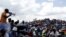Striking miners listen to an address by their leader at the AngloGold Ashanti mine in Carletonville, northwest of Johannesburg October 19, 2012. 