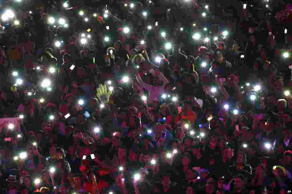 Fans of Spanish singer Isabel Pantoja light up their mobile phones at her performance during the Viña del Mar International Song Festival at the Quinta Vergara in Viña del Mar, Chile, Feb. 22, 2017.