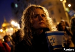 FILE- A woman attends a pro-Israel protest at the 'Shoes on the Danube Bank' memorial, during the ongoing conflict between Israel and the Palestinian Islamist group Hamas, in Budapest, Hungary, October 10, 2023.