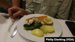 A Portuguese meal of cod fish and potatoes. Cod is one of the most commonly eaten fish in Portugal.