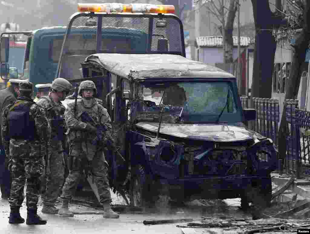 U.S. soldiers arrive at the site of a suicide attack in Kabul, Feb. 26, 2015.