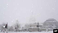 The US Capitol hardly visible in the background, in the middle of a snowstorm, Washington DC, 06 Feb 2010