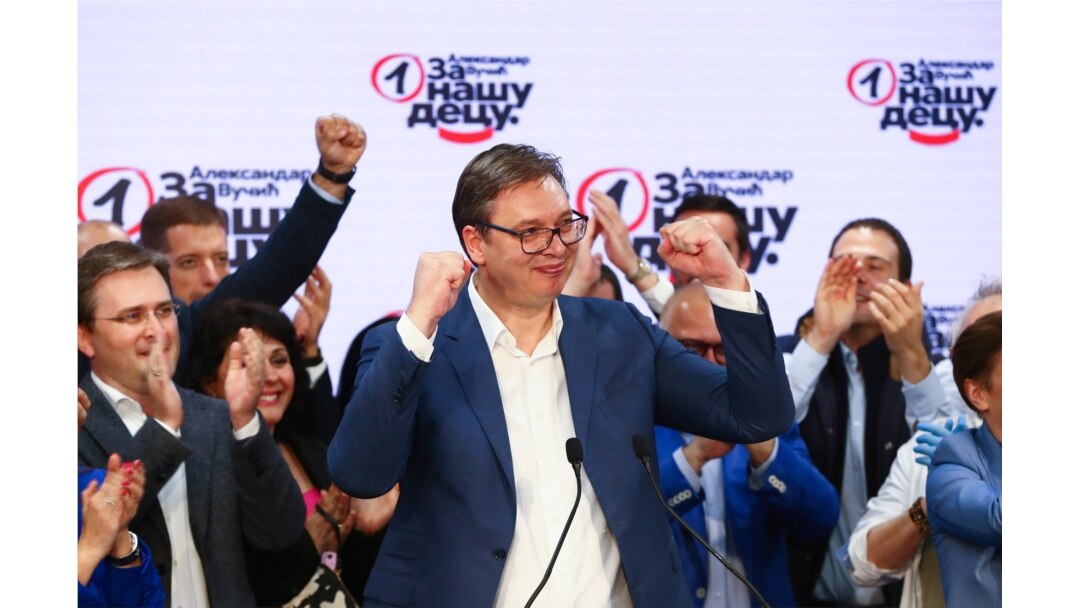 FILE - Serbian President Aleksandar Vucic gestures at Serbian Progressive Party (SNS) headquarters during a national election, the first in Europe since the outbreak of the coronavirus pandemic, in Belgrade, Serbia, June 21, 2020.