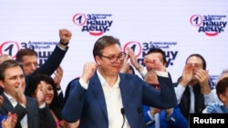 Serbian President Aleksandar Vucic gestures at Serbian Progressive Party (SNS) headquarters during a national election, the first in Europe since the outbreak of the coronavirus pandemic, in Belgrade, Serbia, June 21, 2020. 