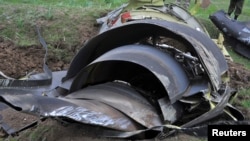 The wreckage of the Boeing KC-135 Stratotanker plane is seen at the site of the crash near the Kyrgyz village of Chaldovar, May 3, 2013.