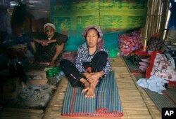 Ethnic Kachin Nlam Numrang Doi, 92, sits along with her husband Hkaraw Yaw, 102, at their hut in compound of Trinity Baptist Church refugee camp for internally displaced people in Myitkyina, Kachin State, northern Myanmar, May 6, 2018.