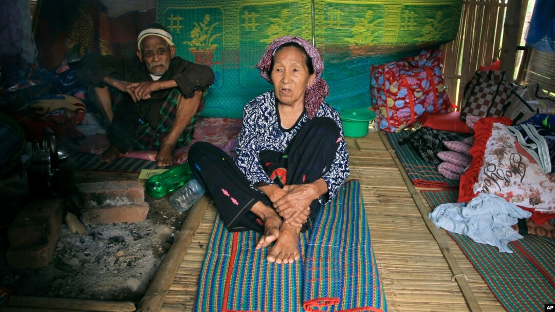 Ethnic Kachin Nlam Numrang Doi, 92, sits along with her husband Hkaraw Yaw, 102, at their hut in compound of Trinity Baptist Church refugee camp for internally displaced people in Myitkyina, Kachin State, northern Myanmar, May 6, 2018.