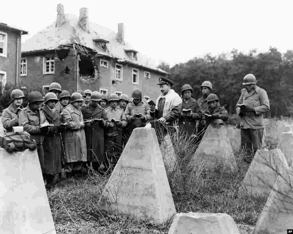 Chaplain Robert Marcus leads services at German “dragon’s teeth” after the Battle of the Bulge, January 1945. (Photo courtesy Jewish Chaplains Council)