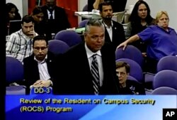 FILE - This Feb. 18, 2015 image taken from video provided by Broward County Public Schools shows school resource officer Scot Peterson during a school board meeting of Broward County, Fla.