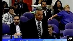 FILE - This Feb. 18, 2015 image taken from video provided by Broward County Public Schools shows school resource officer Scot Peterson during a school board meeting of Broward County, Fla.
