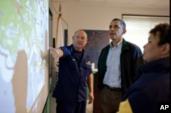 US Coast Guard Commandant Admiral Thad Allen and EPA Administrator Lisa Jackson, brief President Barack Obama about the situation along the Gulf Coast following the BP oil spill, at the Coast Guard Venice Center in Louisiana.